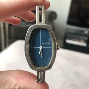 Vintage La Forge watch with navy backdrop